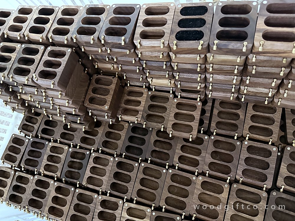 Walnut box bodies held in machining fixtures