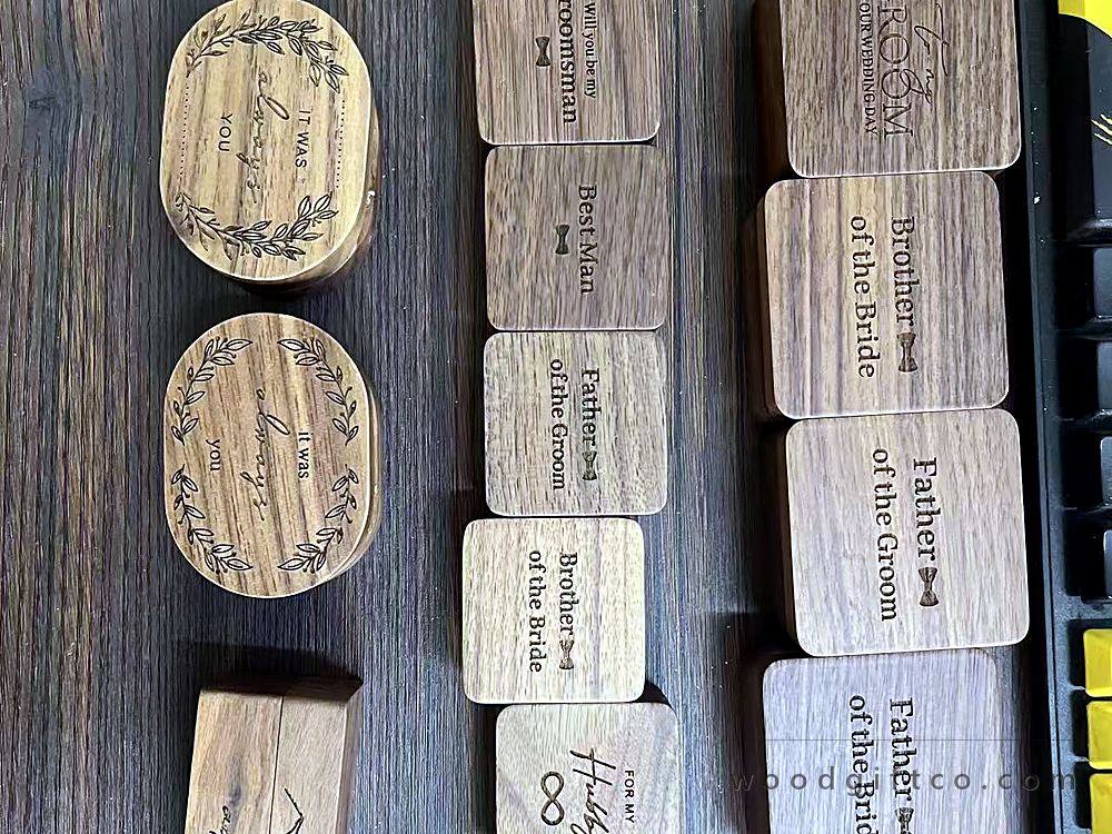 Engraved walnut samples reading Groomsman, Best Man and Father of the Bride