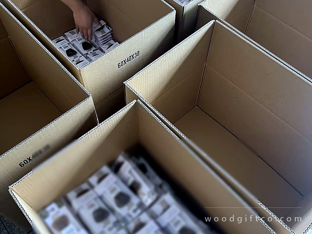 Components being kitted into partitioned cartons